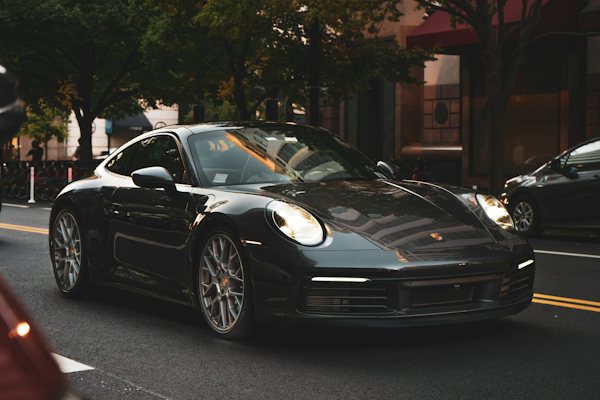 Black Porsche 911 on a city street