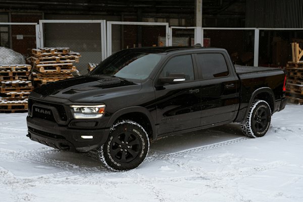 Black Ram 1500 parked in snow